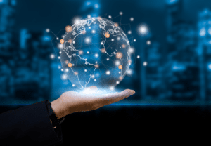 Image of a hand holding a graphic image of a globe representing communcation through technology