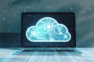 Image of a laptop with a graphic of a cloud representing cloud technology