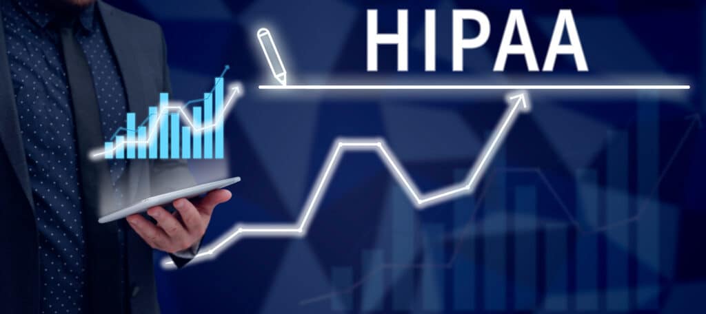Graphic image of a person holding a tablet with a graph overlay and the word "HIPAA"