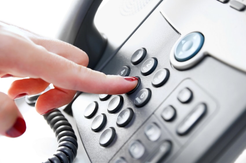 Image of a person dialing a phone on Softlinx' website