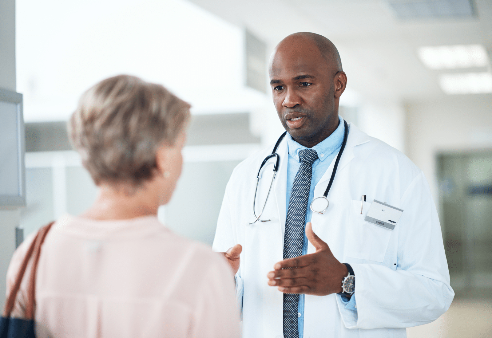 Image of a doctor speaking with a patient