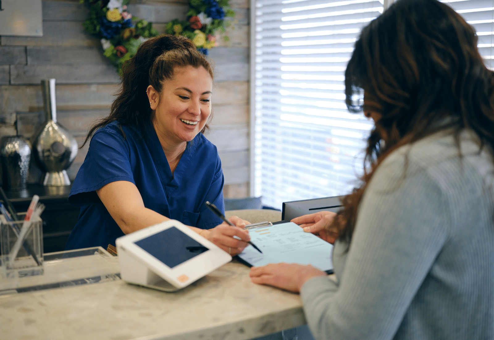 Image of two women in a small medical office