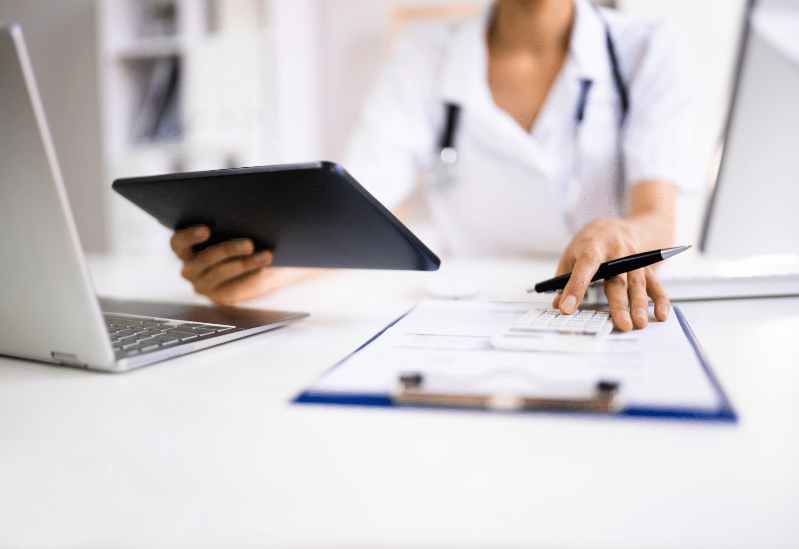 Image of a person in a medical office using a tablet