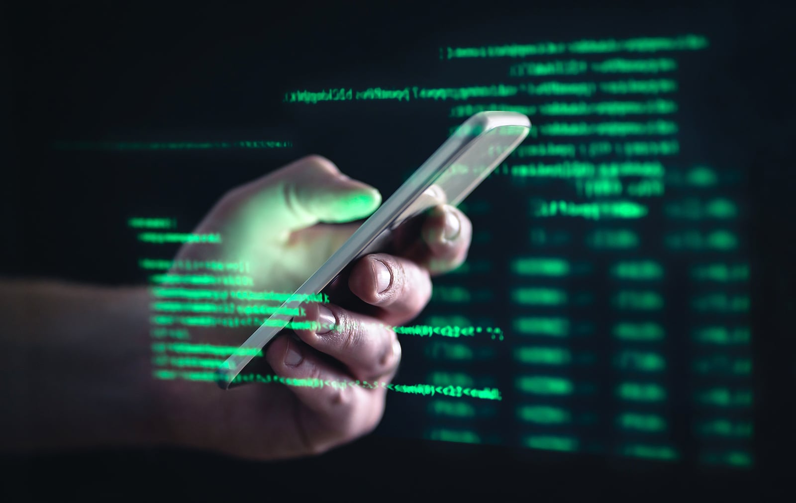 Image of a person using a cellphone with a graphic overlay representing digital fraud