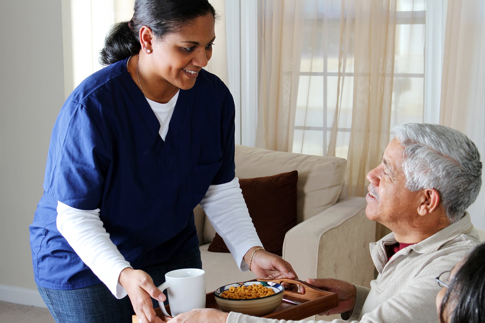 Image of a home healthcare worker and an elderly patient