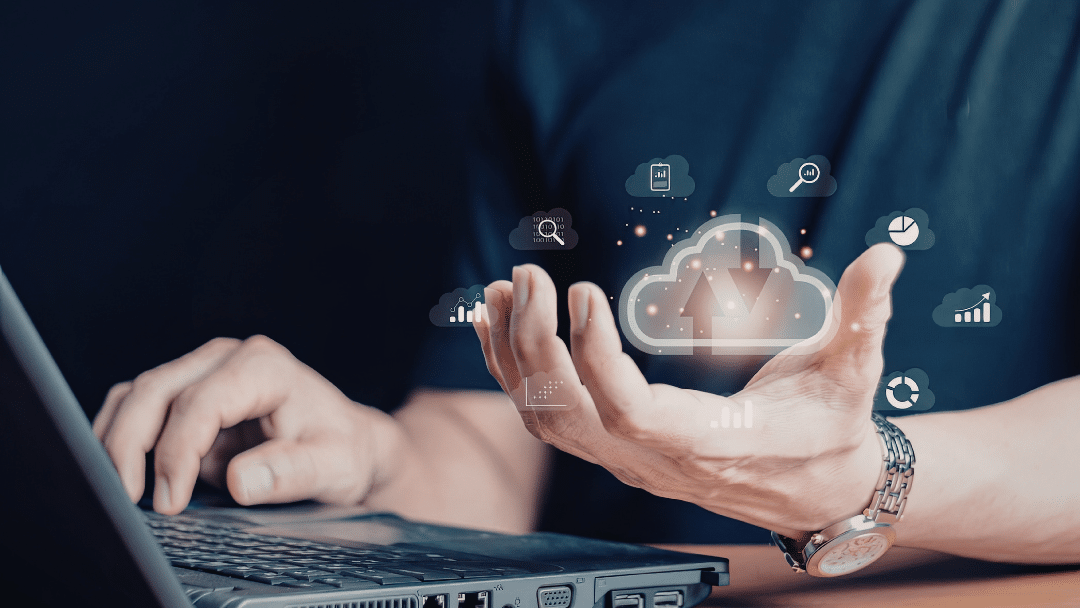 Person at a laptop holding a glowing cloud icon with data icons, representing the step-by-step process of switching from fax machine to cloud fax.
