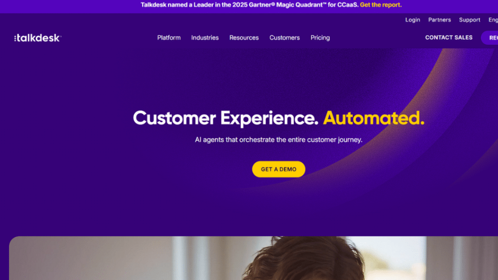 Talkdesk homepage showcasing its AI-powered customer experience platform with headline "Customer Experience. Automated." and tagline "AI agents that orchestrate the entire customer journey", featuring "GET A DEMO" button and Gartner Leader mention.